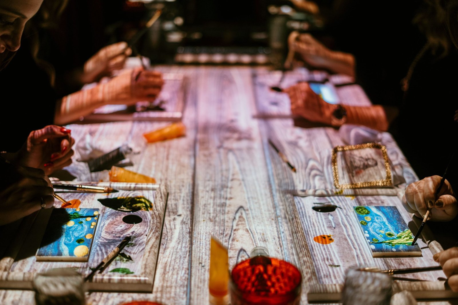 This image shows guests participating in the Seven Paintings Immersive Dining Experience in Dubai. 
